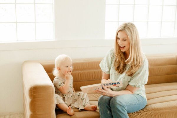 toddler and speech therapist reading